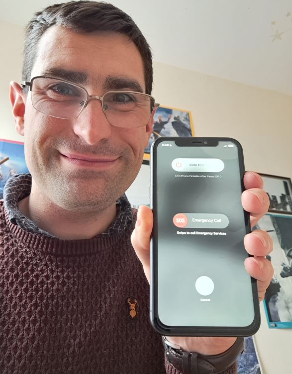 Me Proudly Holding the Repaired iPhone 11